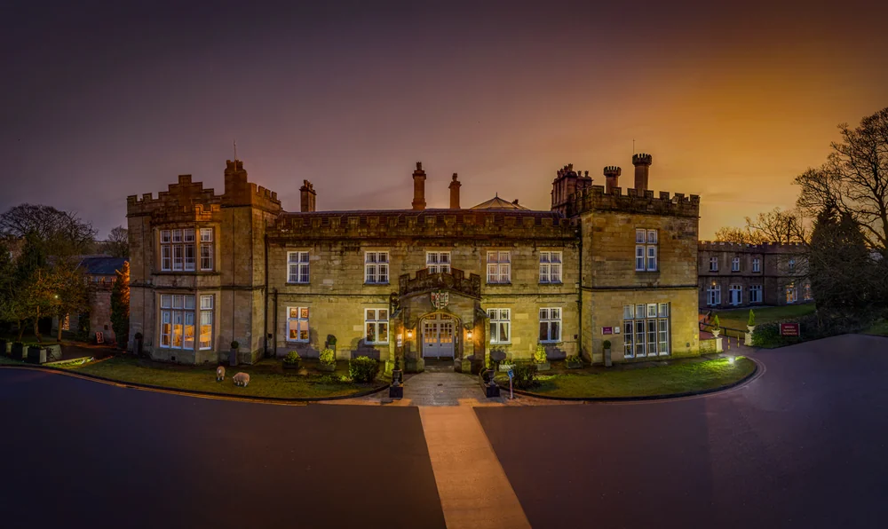 The Dunkenhalgh Hotel lit at dusk